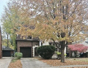 Storybook Oak Park brick home built in 1940 in autumn.