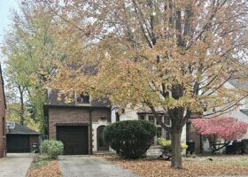 Storybook Oak Park brick home built in 1940 in autumn.